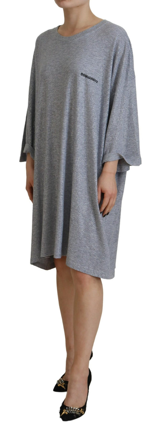 A gray dress with crystal embellishments on long sleeves