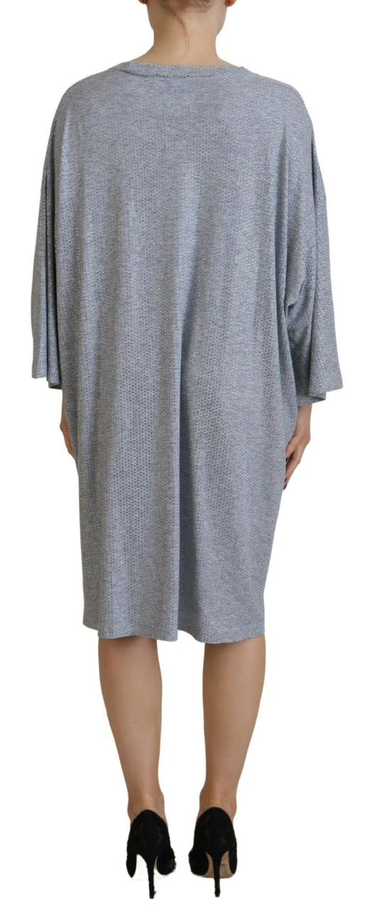 A gray dress with crystal embellishments and long sleeves