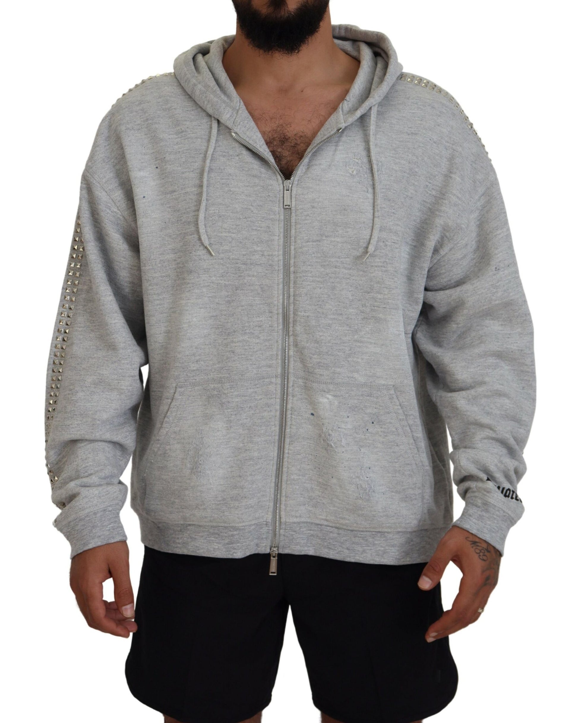 Man wearing gray hoodie and black shorts