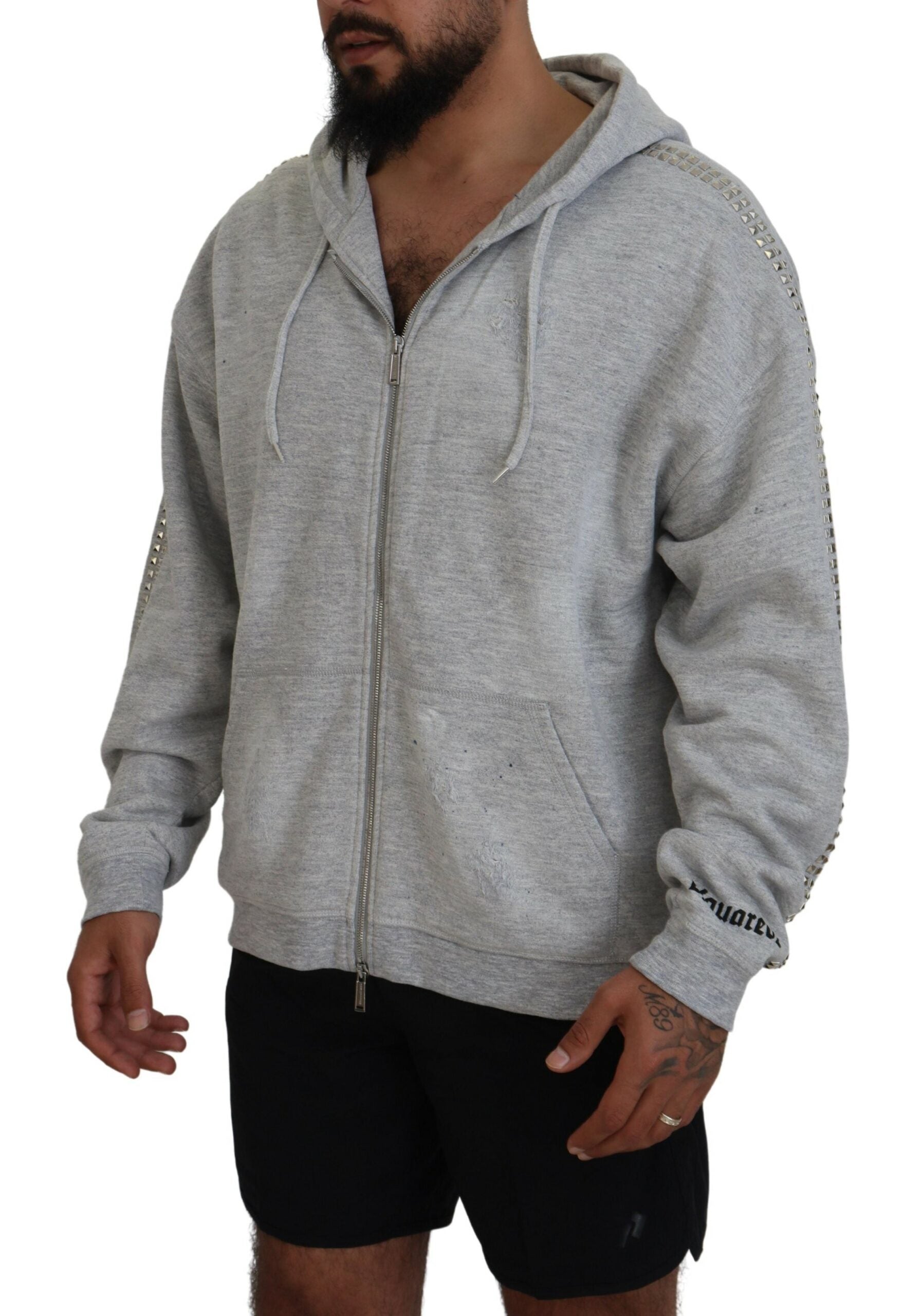 Man wearing gray hoodie and black shorts