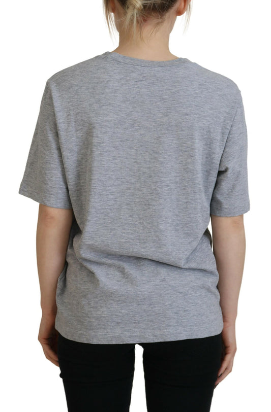Grey short sleeve t-shirt on a person from behind