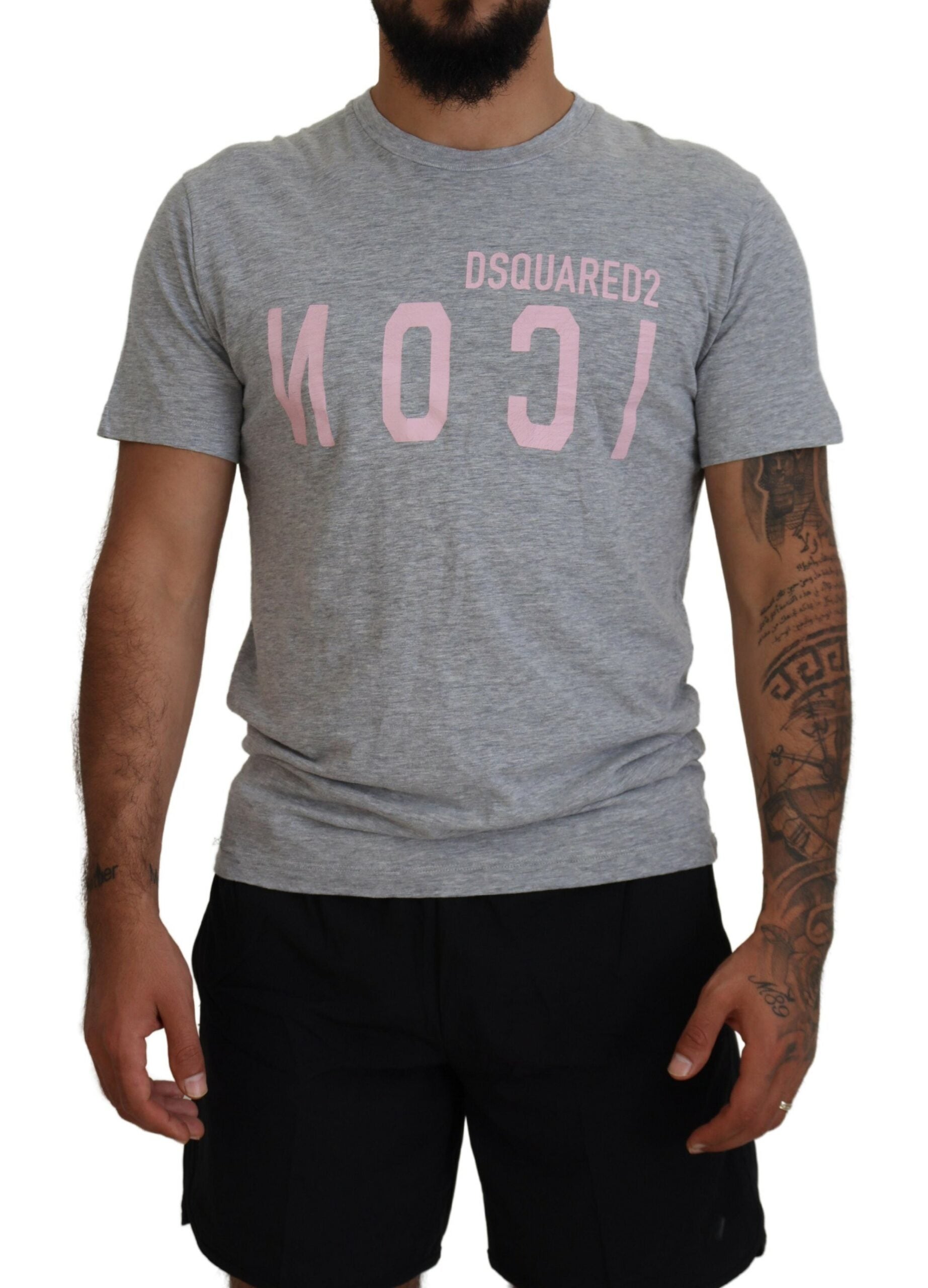 Man wearing gray t-shirt with pink logo