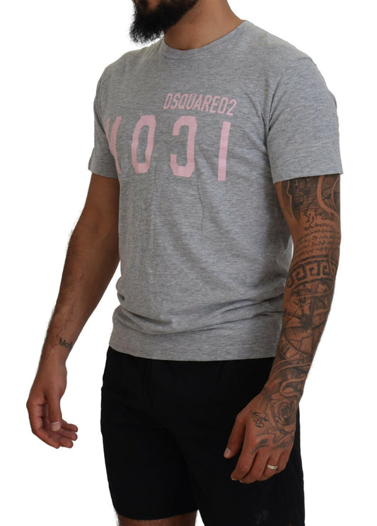 Man wearing gray t-shirt with pink lettering