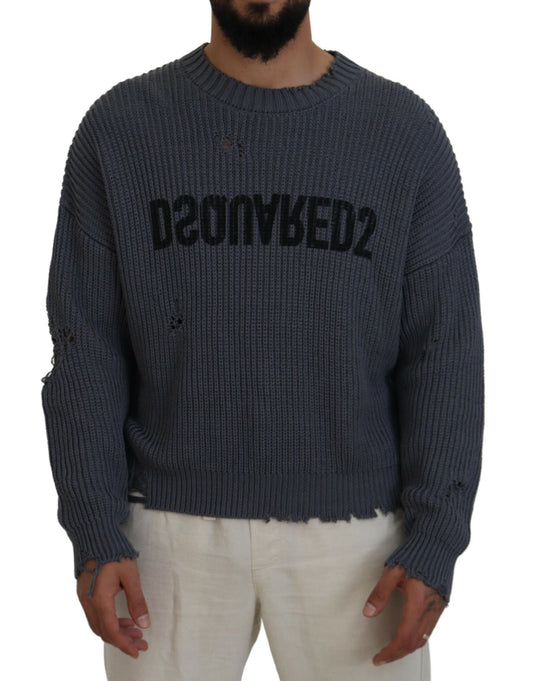 Man wearing a gray sweater with black lettering