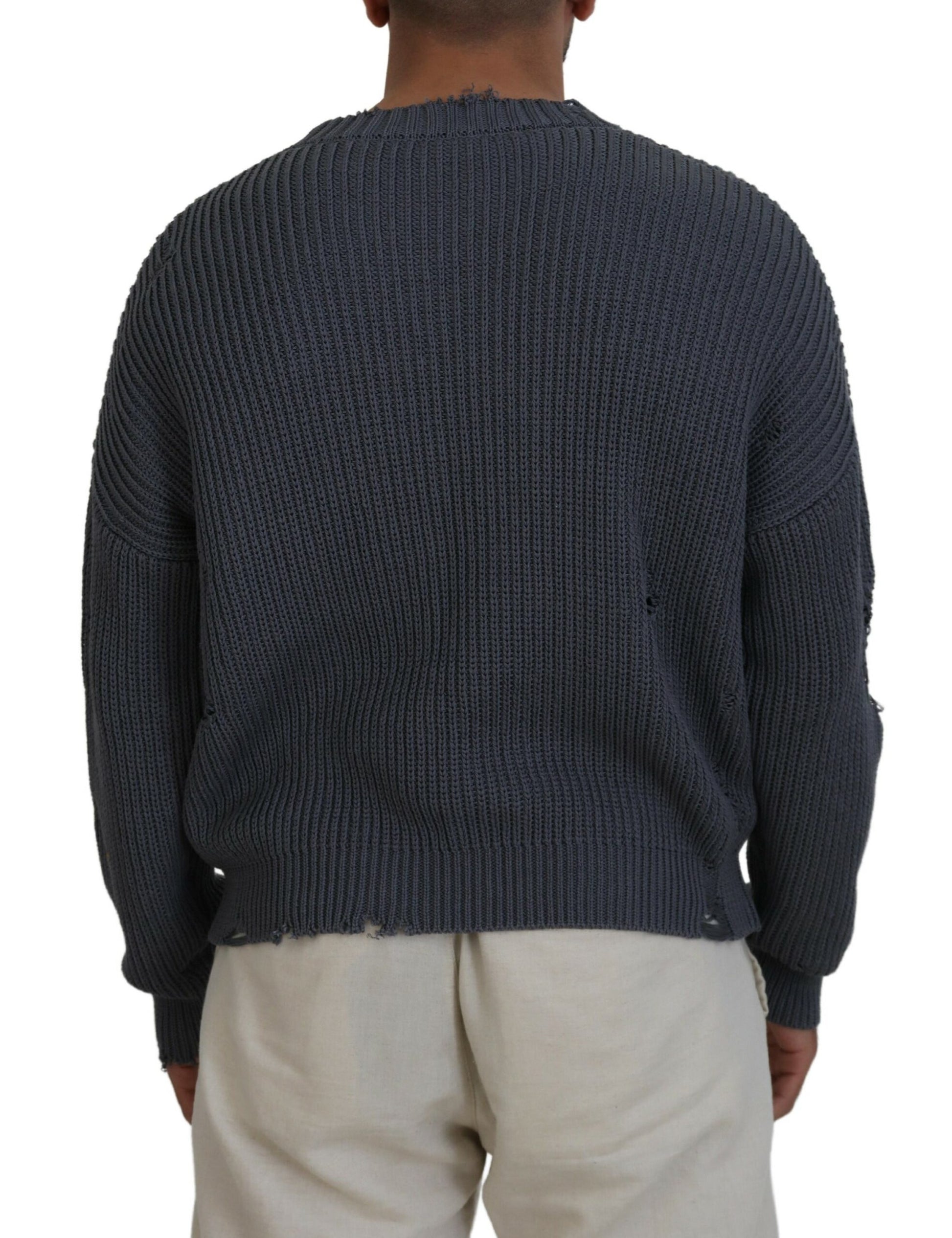 Man wearing blue knit sweater