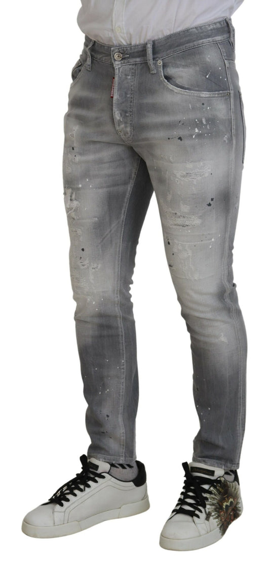 Pair of distressed jeans worn by a person
