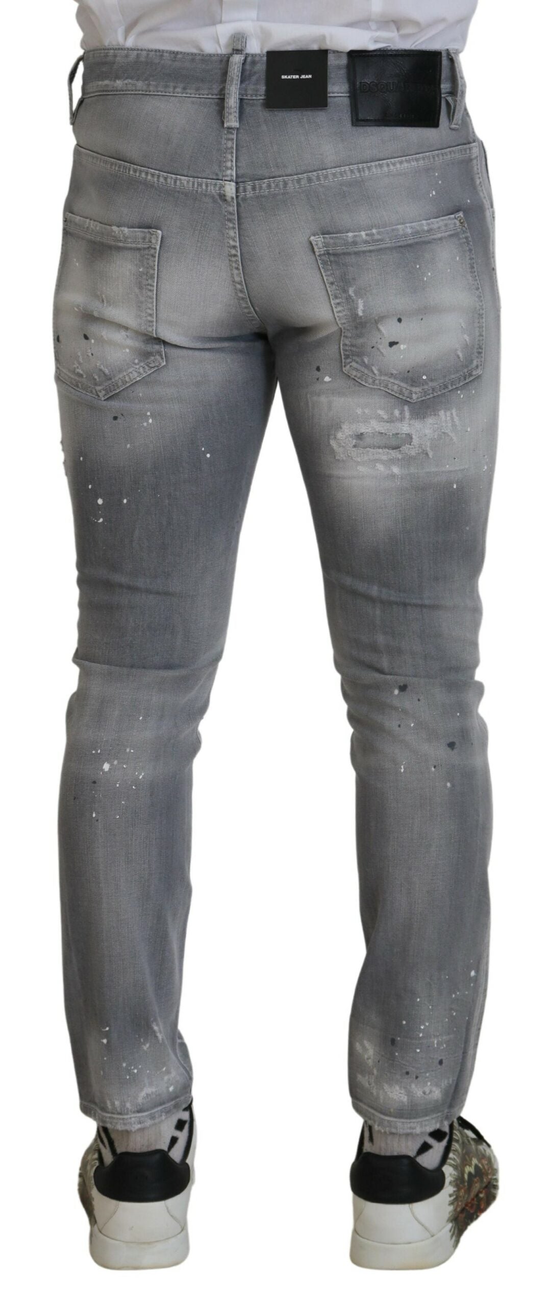 Pair of light blue denim jeans with distressed design