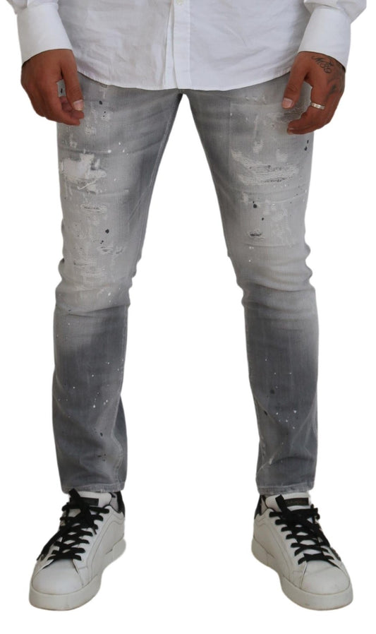 Man wearing distressed jeans and sneakers