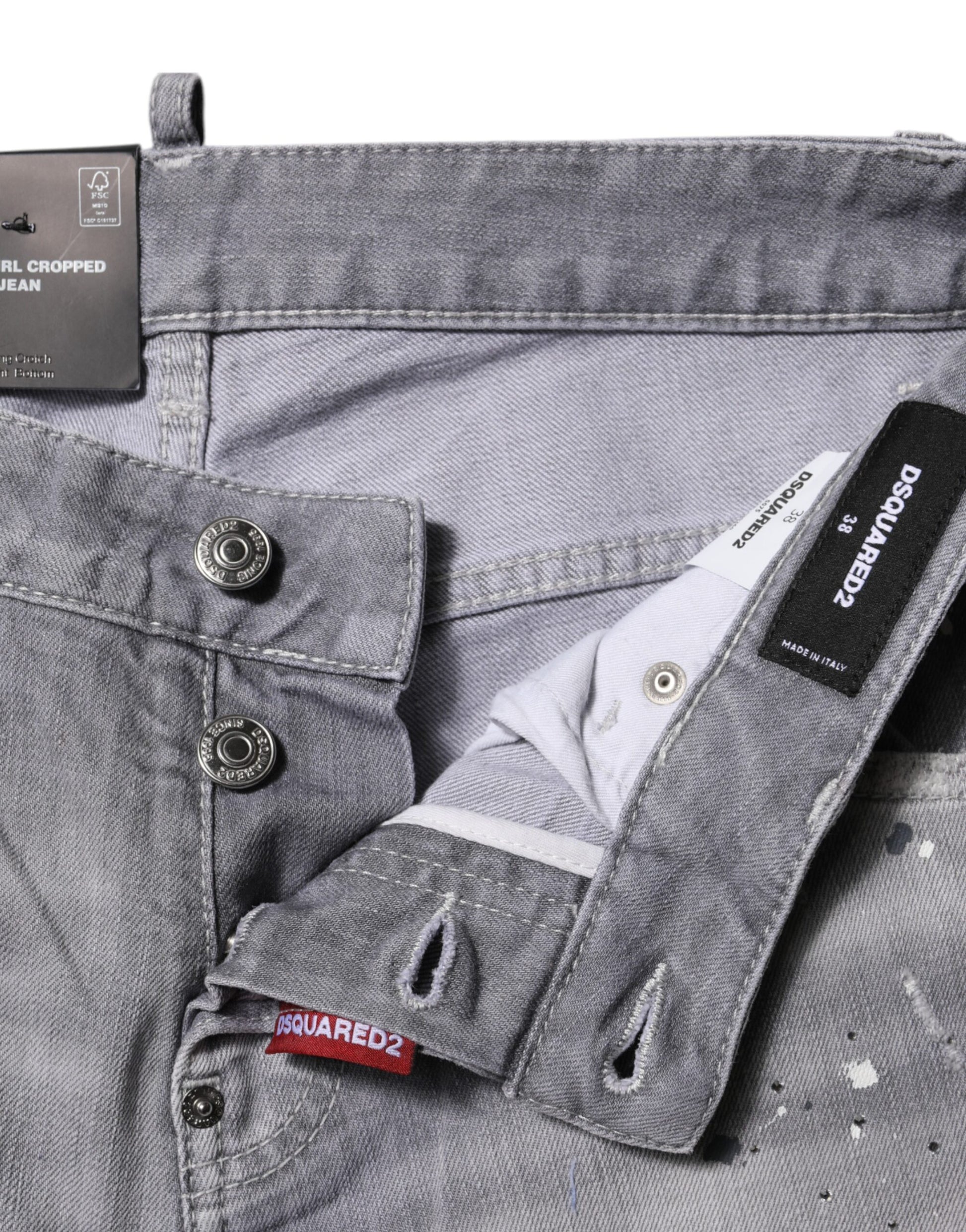 Pair of blue jeans with button closure