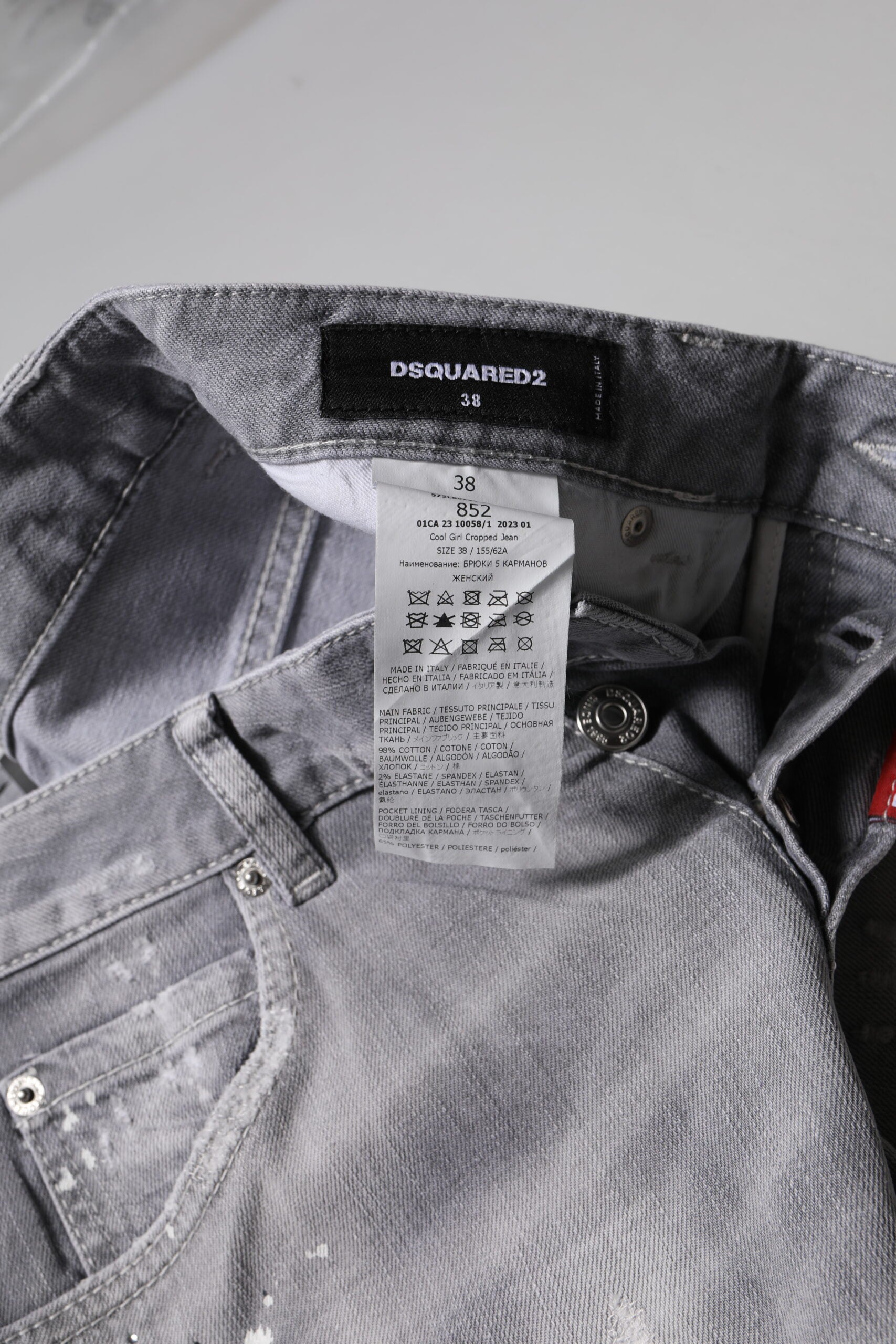 Blue denim jeans on hanger with tag