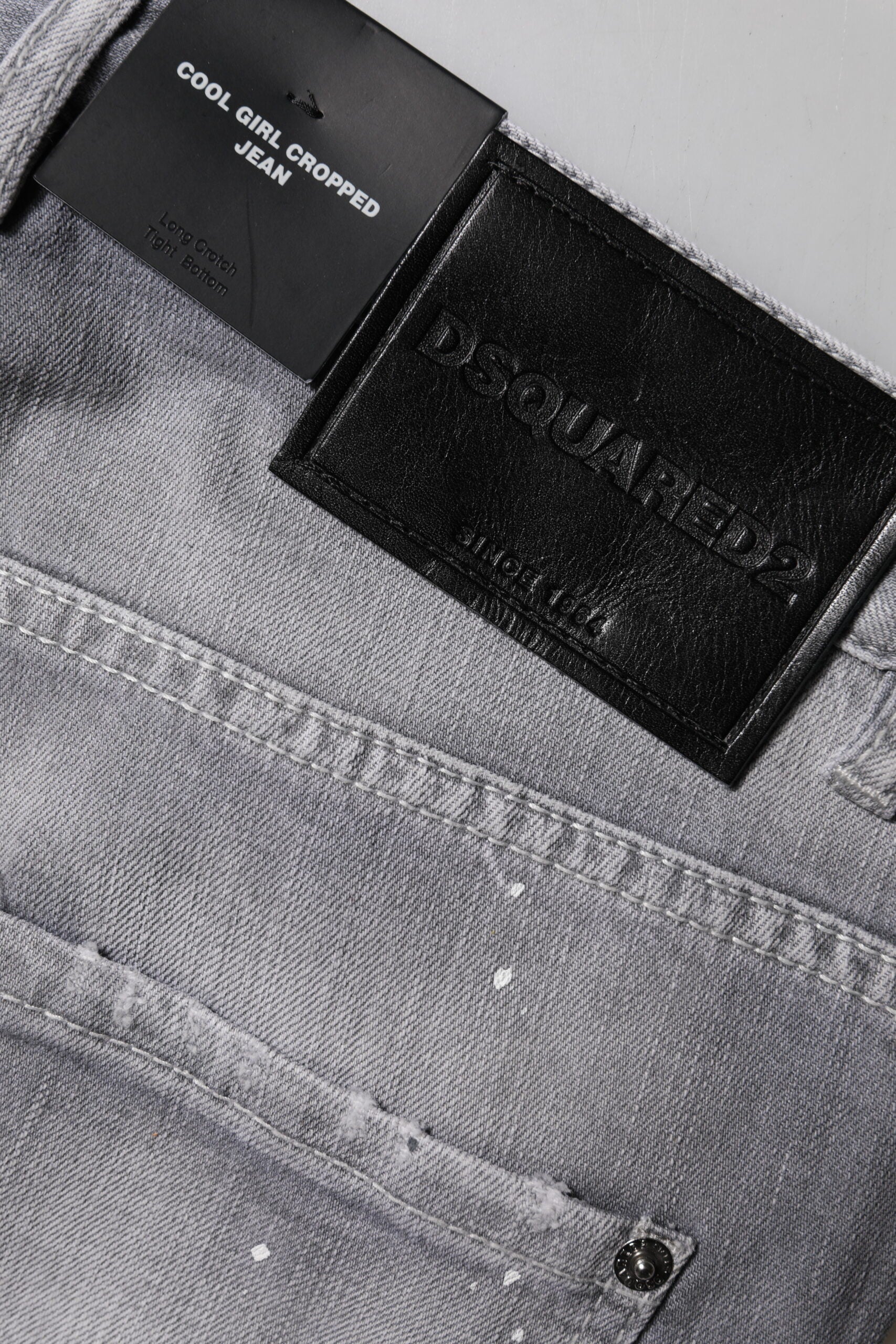 Pair of blue jeans with black label on waistband
