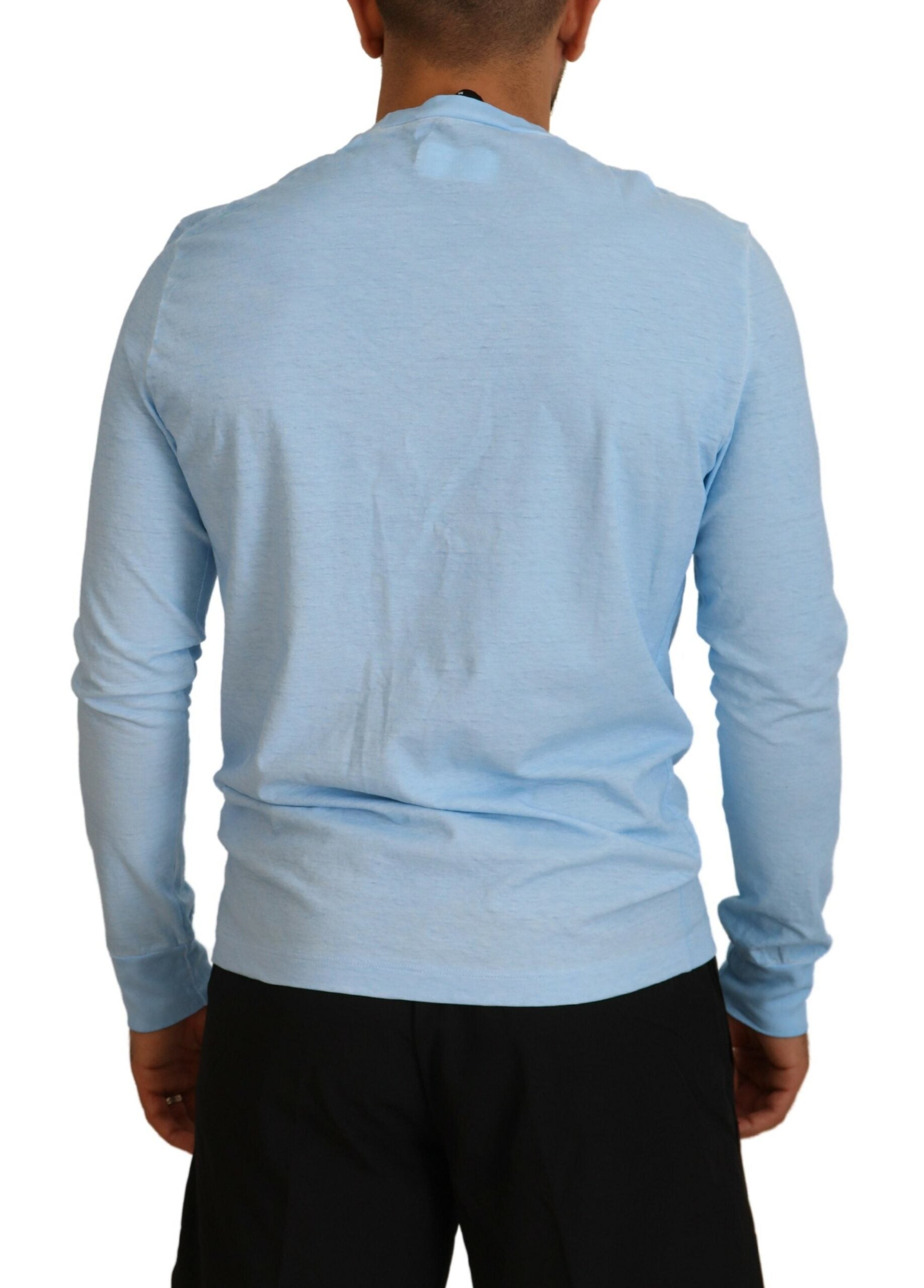 Long sleeve blue shirt on man's back