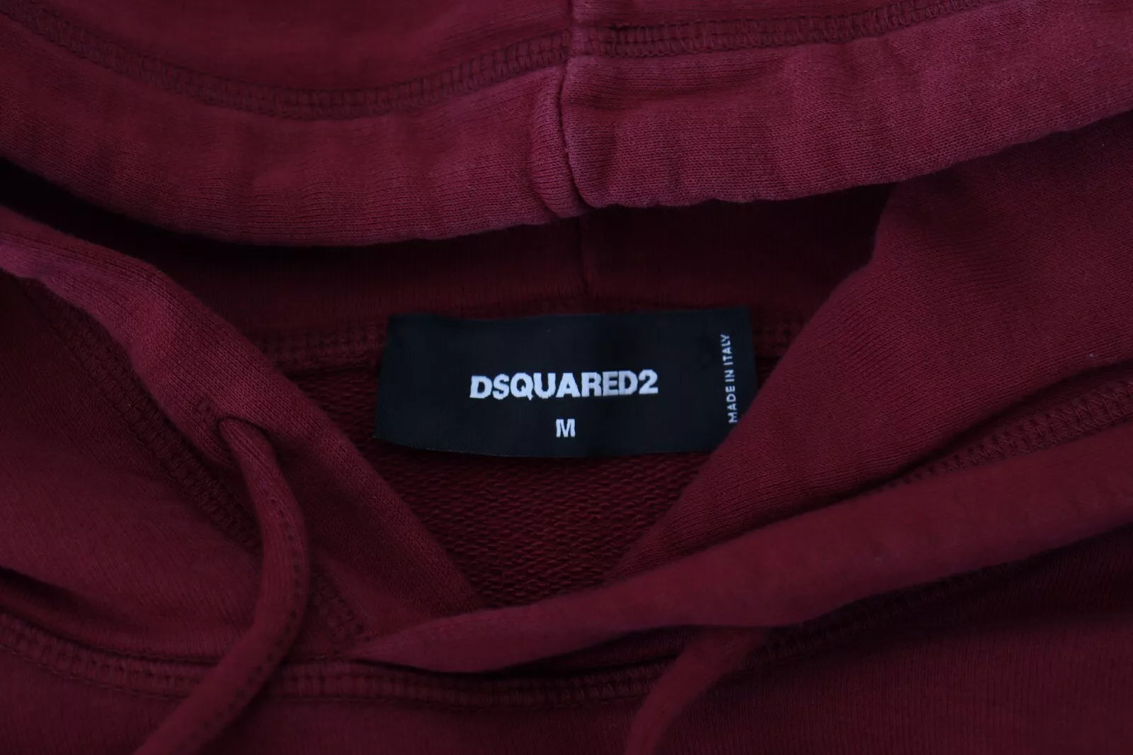 Red hoodie with black label inside