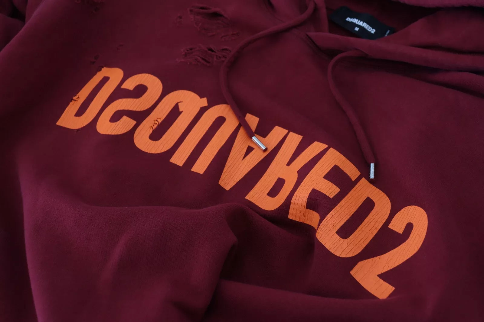 Red hoodie with white lettering