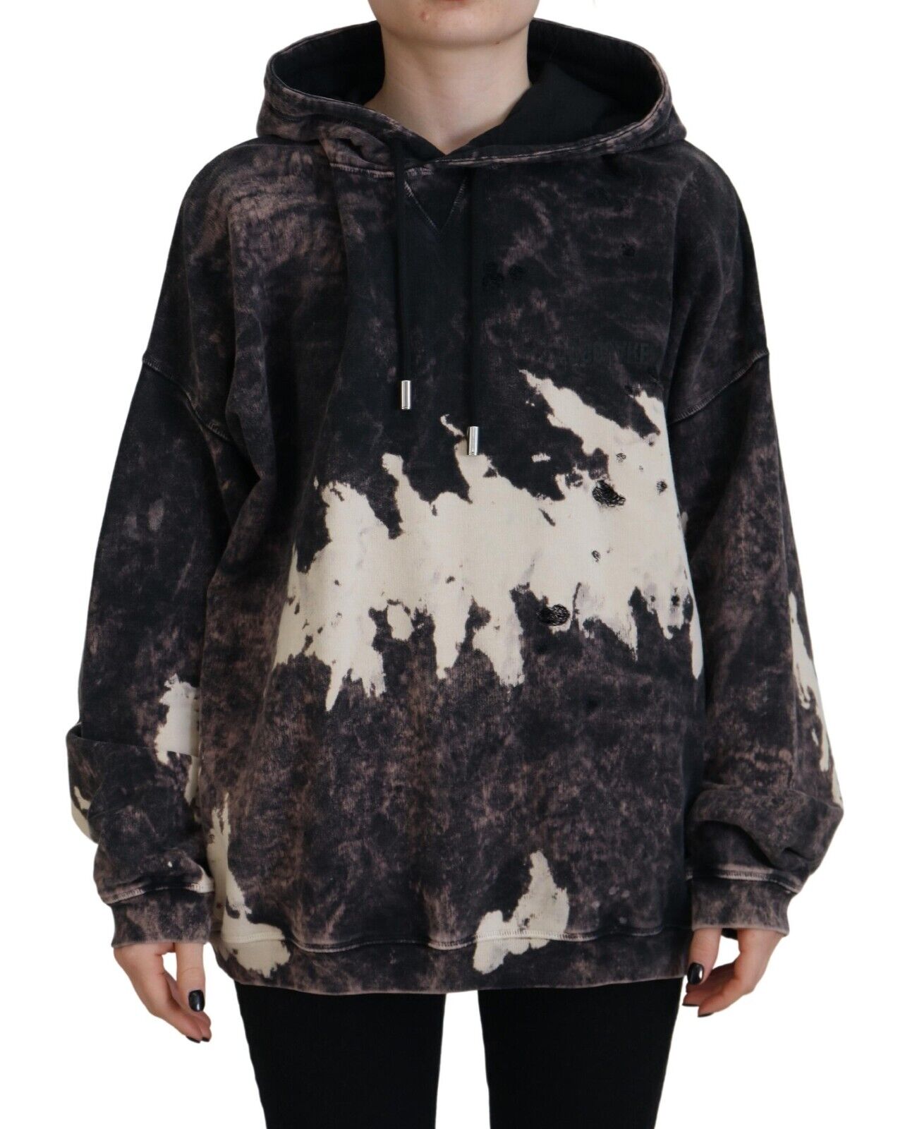 Woman wearing a camouflage hoodie with distressed design