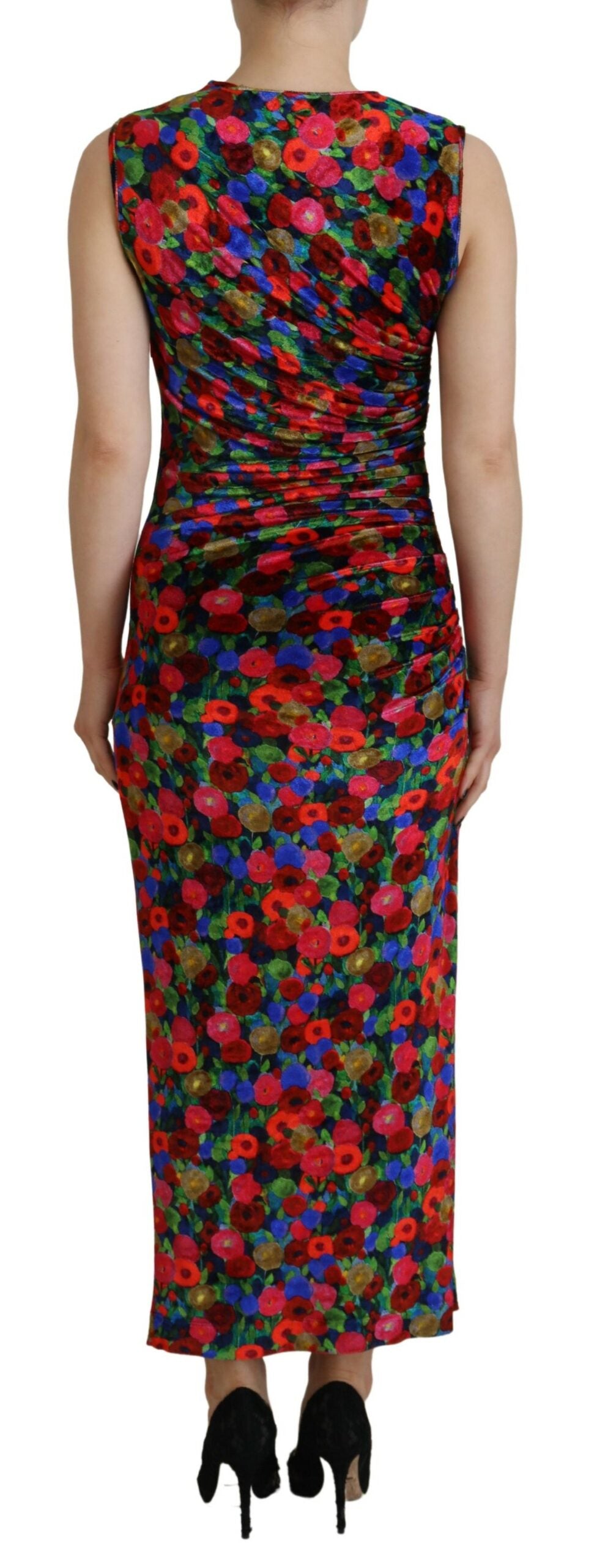 A long sleeve, ruched maxi dress with a floral pattern and high neckline