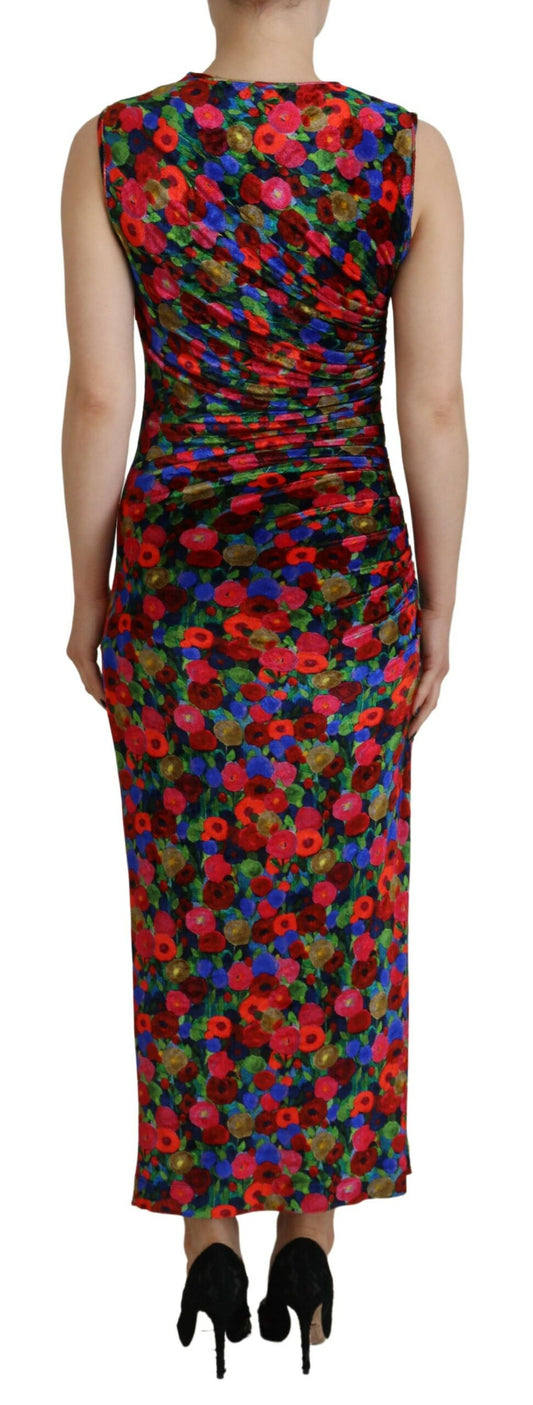 A long sleeve, ruched maxi dress with a floral pattern and high neckline