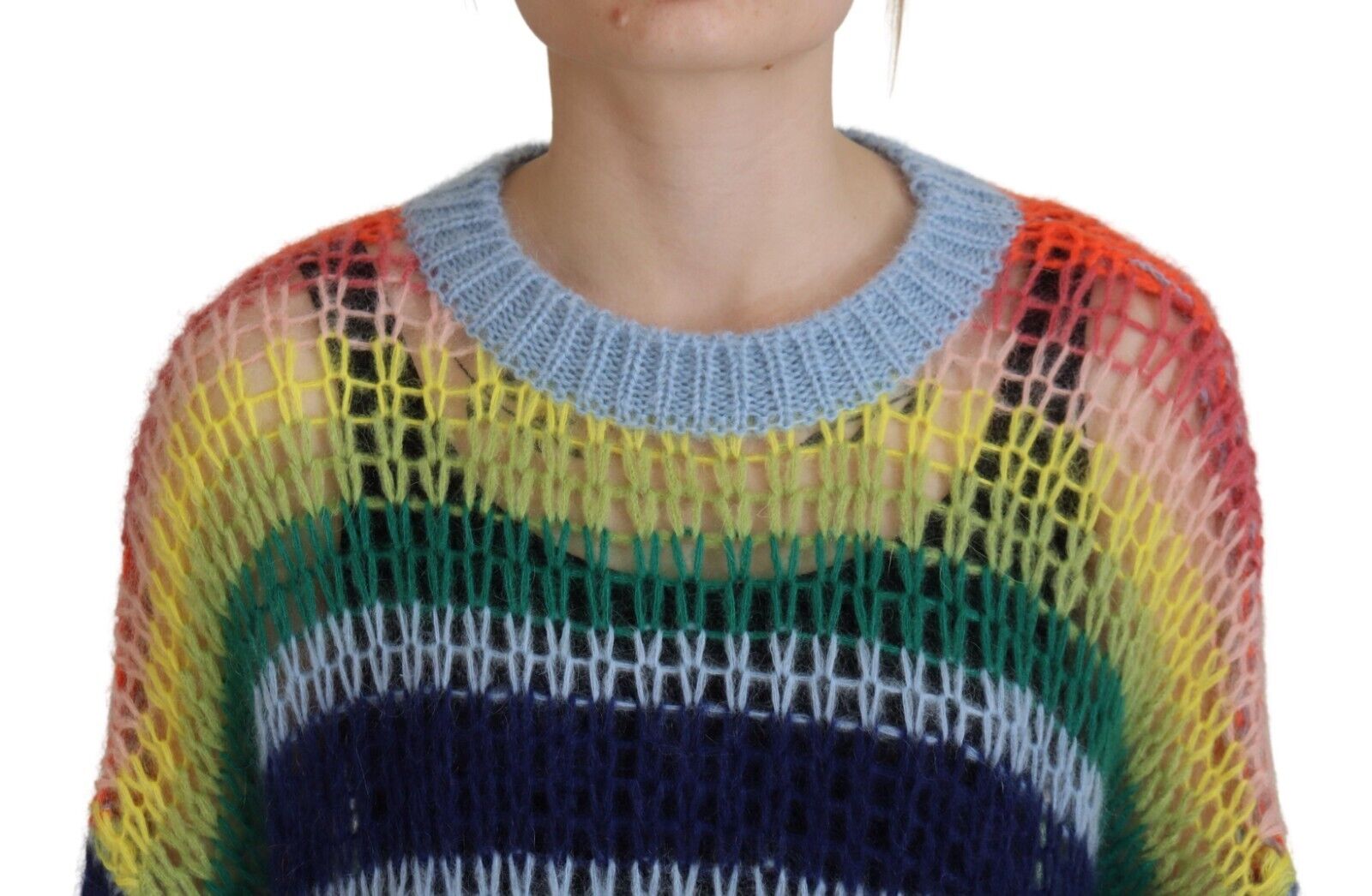 Colorful crocheted sweater on woman's shoulders