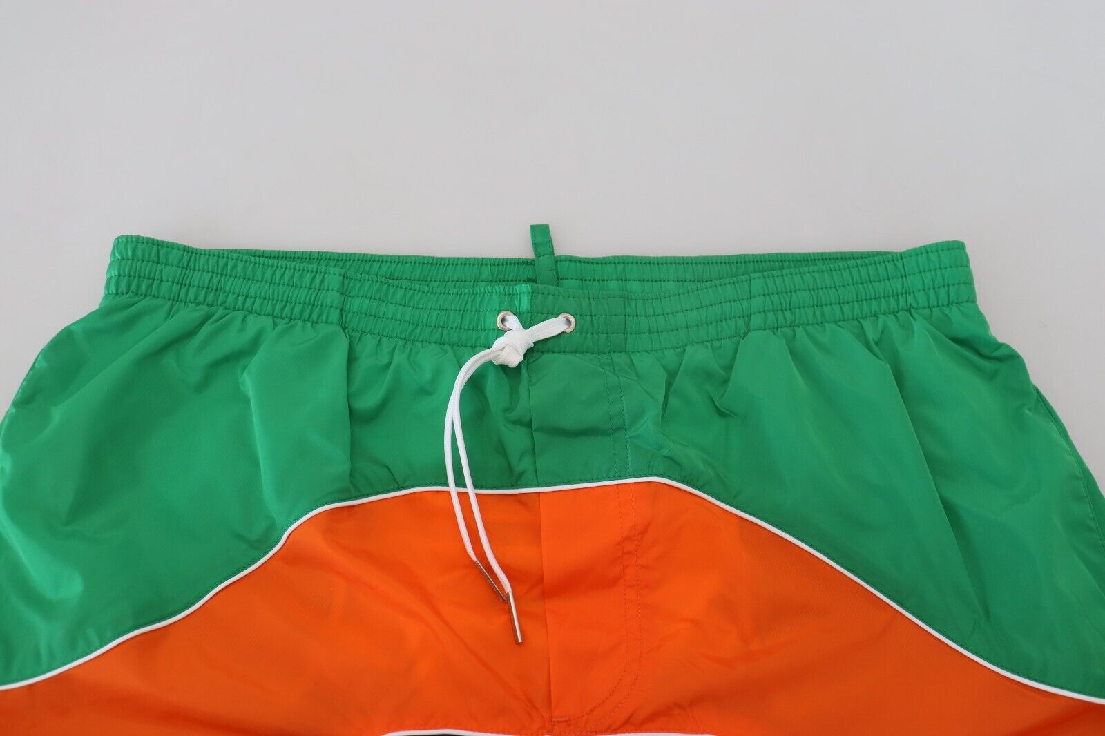 Green and orange swim trunks