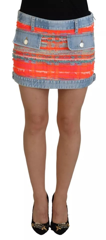 Woman wearing a skirt with red, orange, yellow, green, blue, and black colors