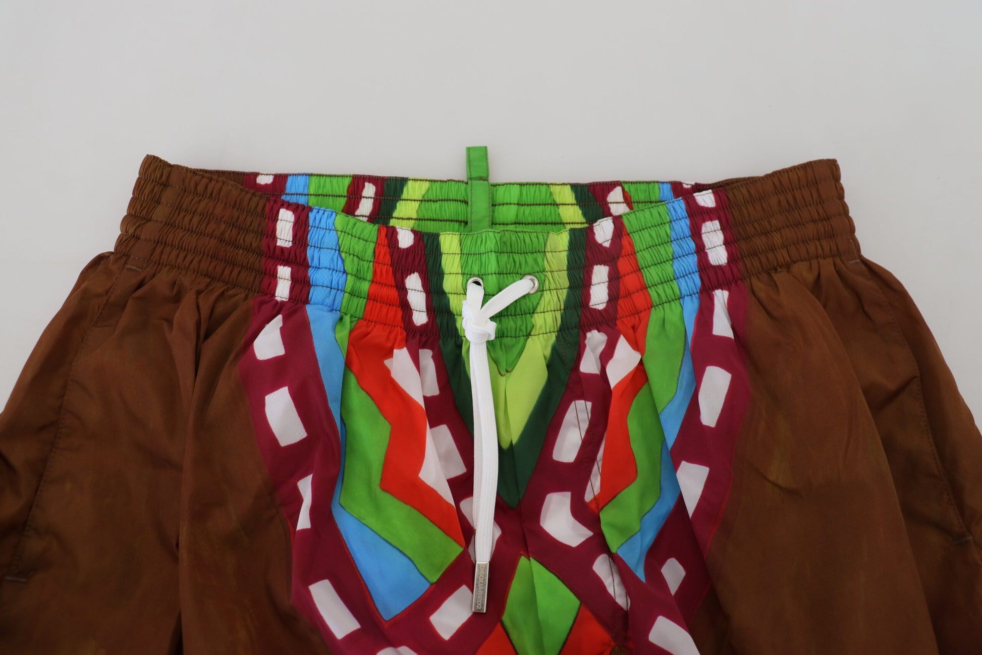 Colorful patterned shorts on hanger