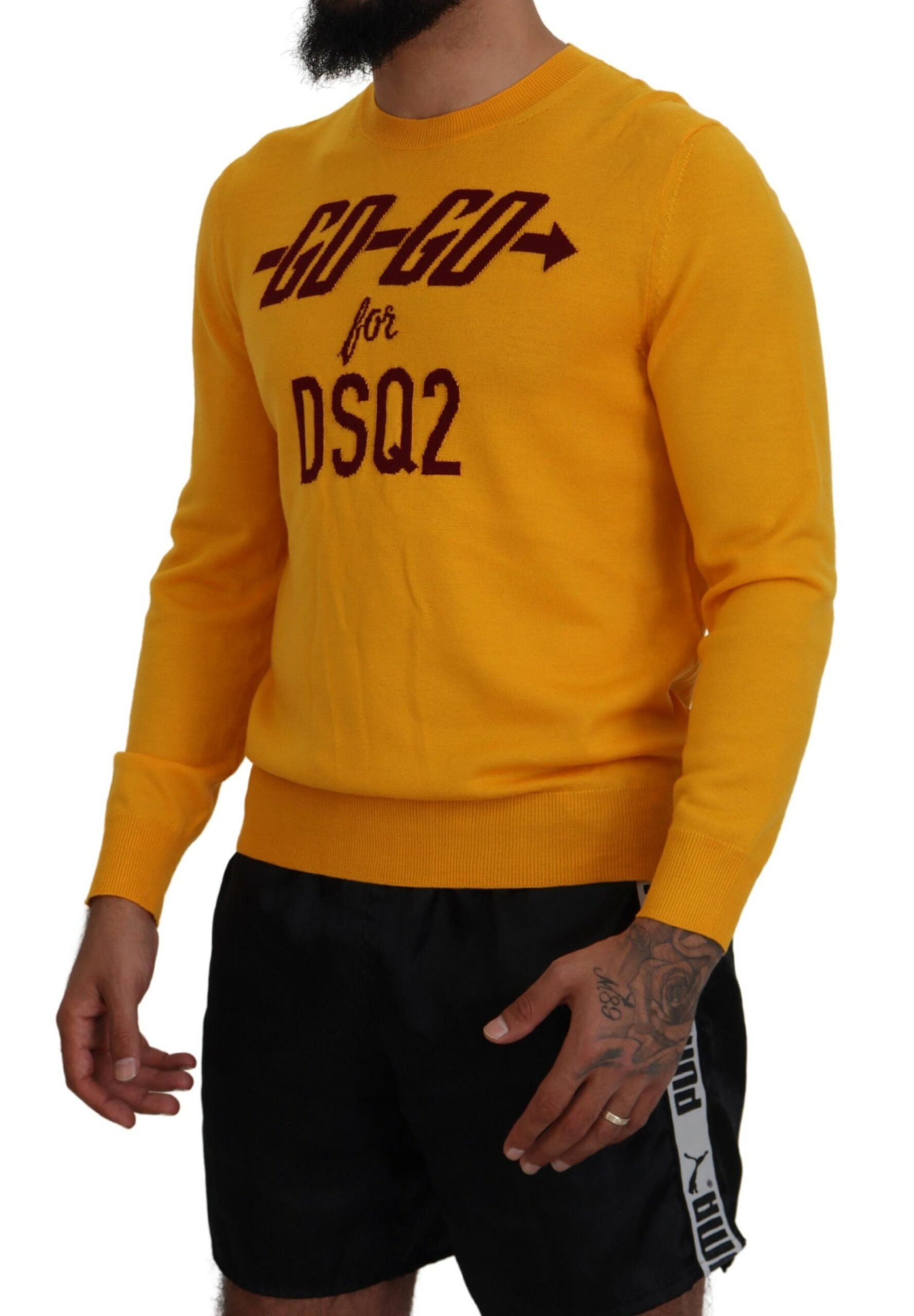 Man wearing yellow sweater with red lettering