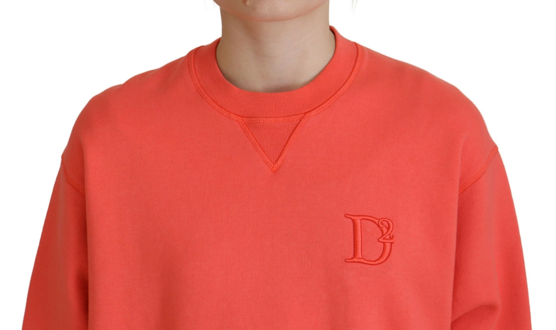 Red sweater with a logo on the chest