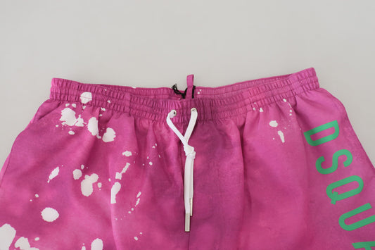 Pink shorts with green writing
