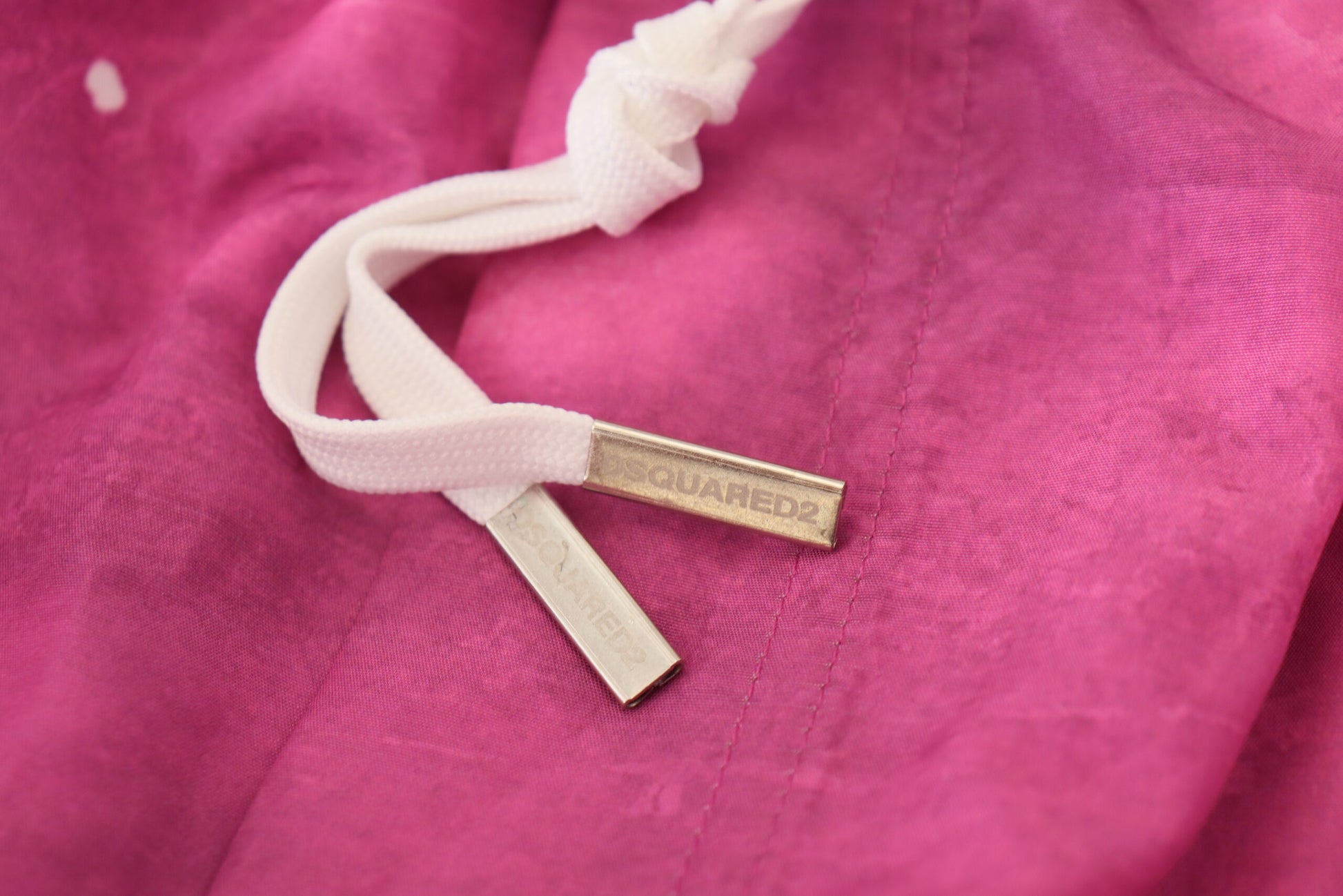 Gold embroidered emblem on fabric