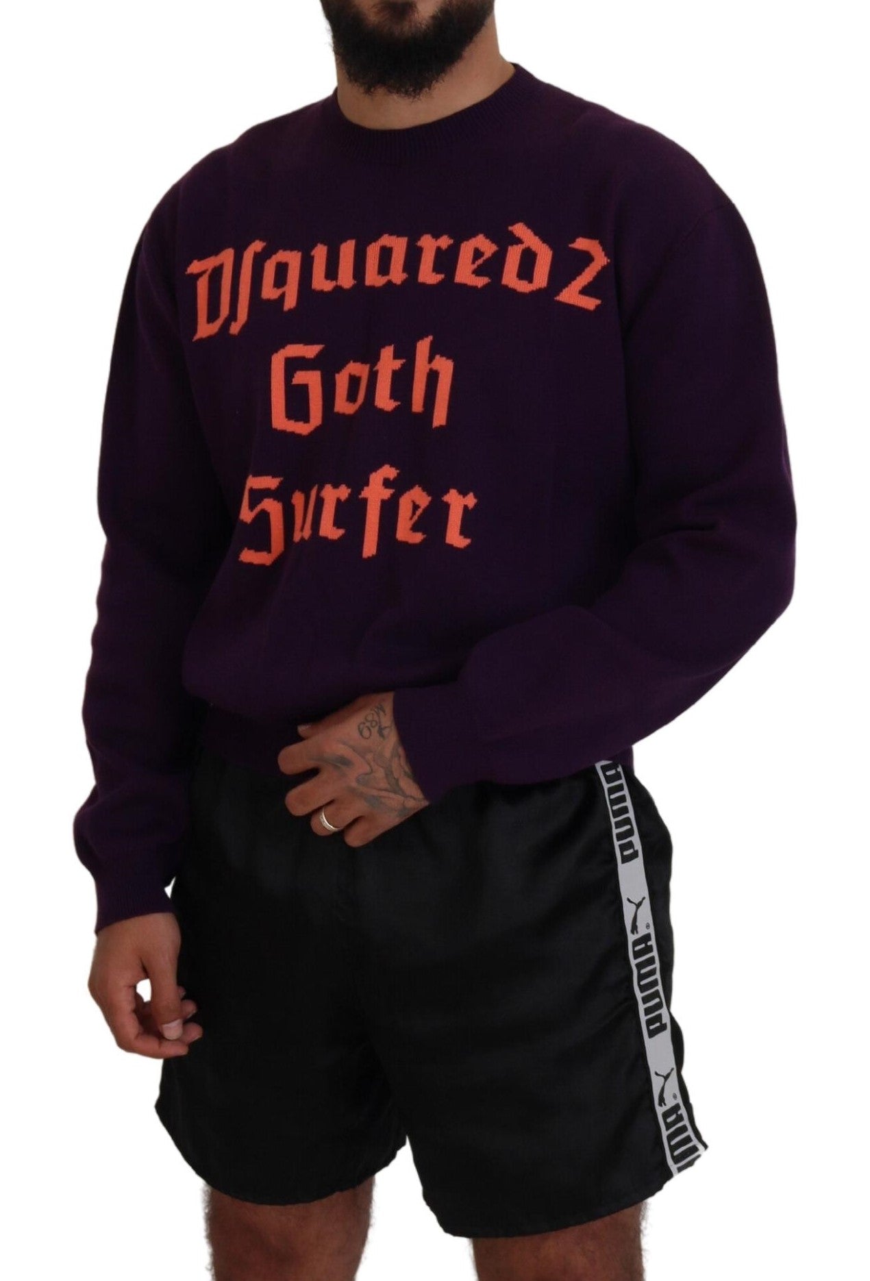 Man wearing purple sweatshirt with orange lettering