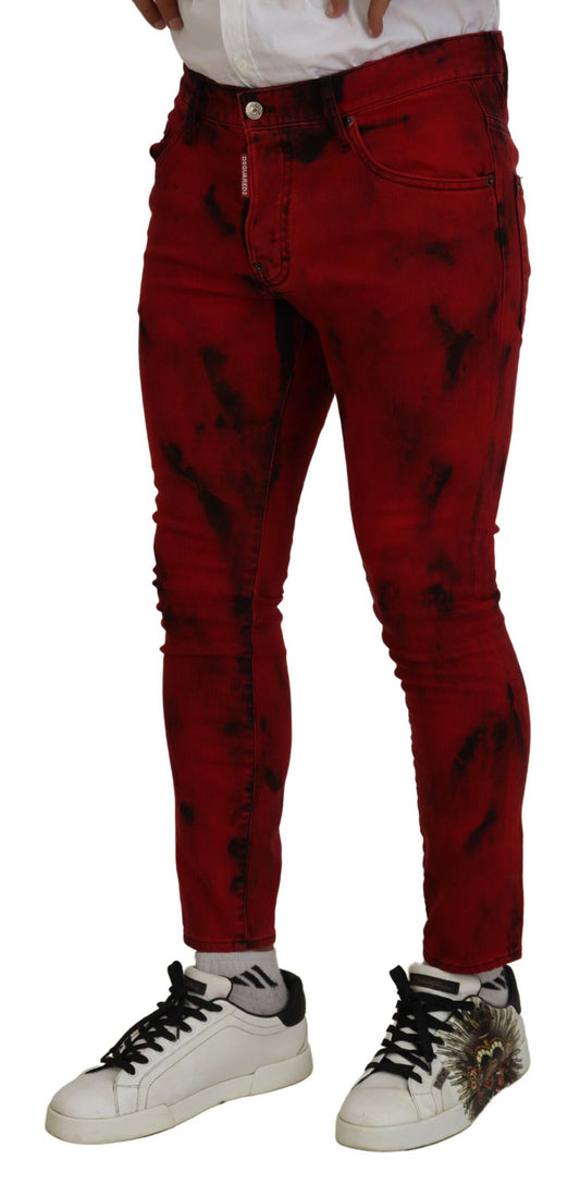 Red distressed jeans with black laces on sneakers