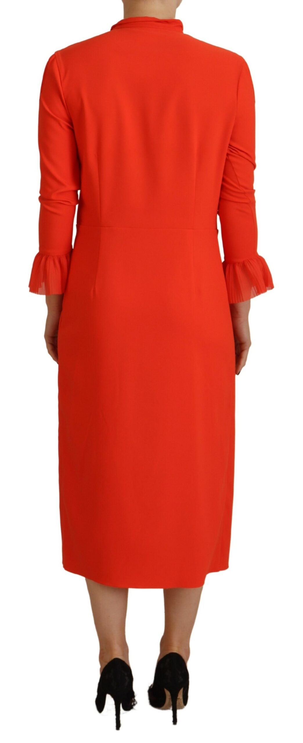 A red midi dress with long sleeves, pleats and a high neckline
