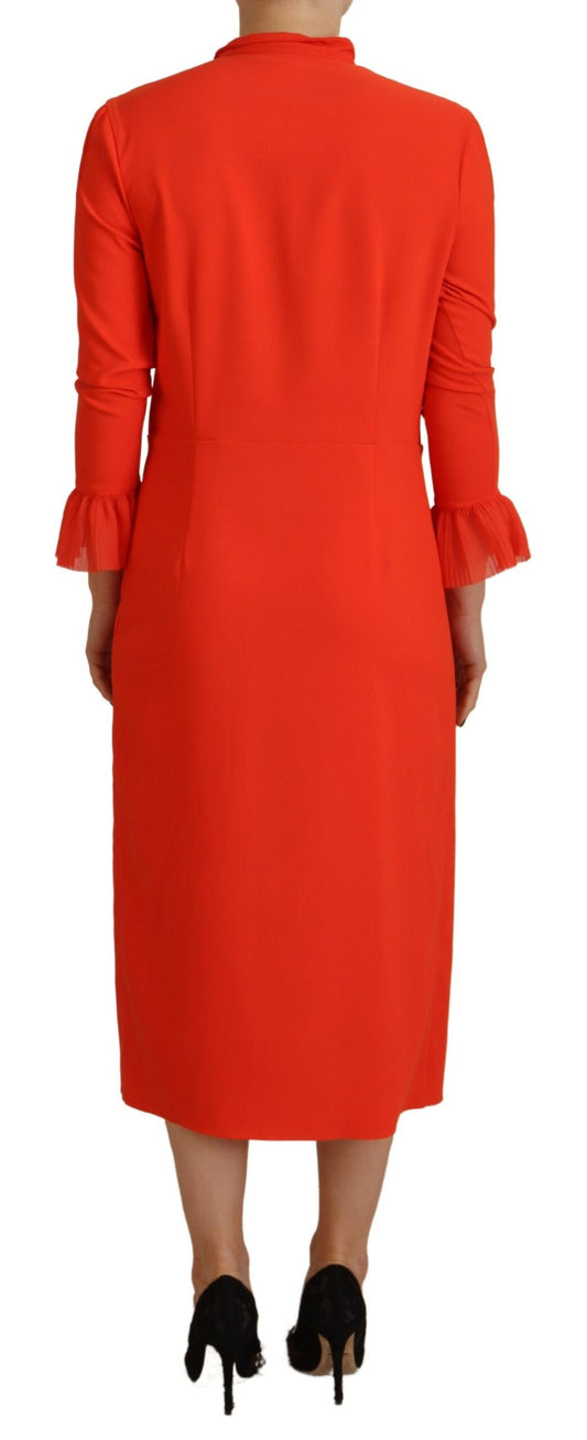A red midi dress with long sleeves, pleats and a high neckline