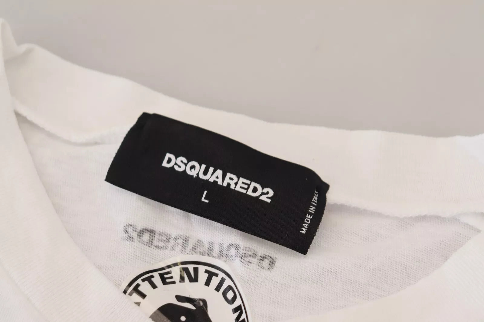 White t-shirt with black label