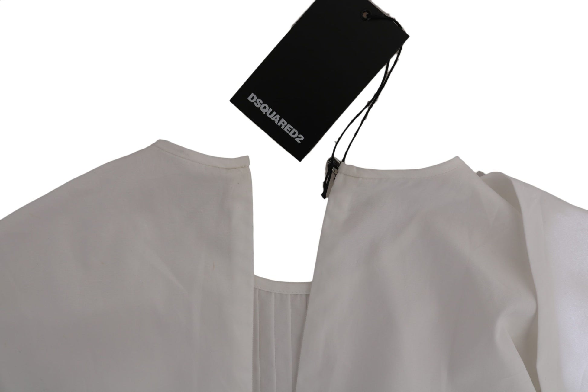 White garment on hanger with tag
