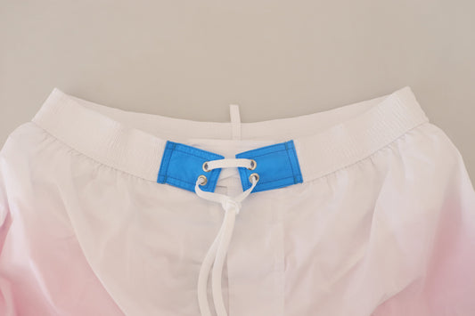 White shorts with blue straps and buckle