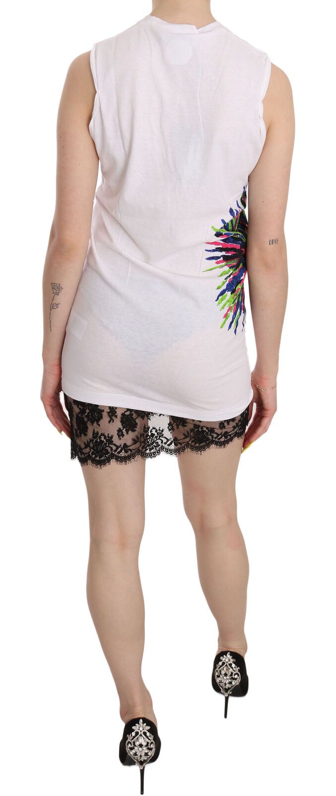 A sleeveless white dress with a colorful print on the back