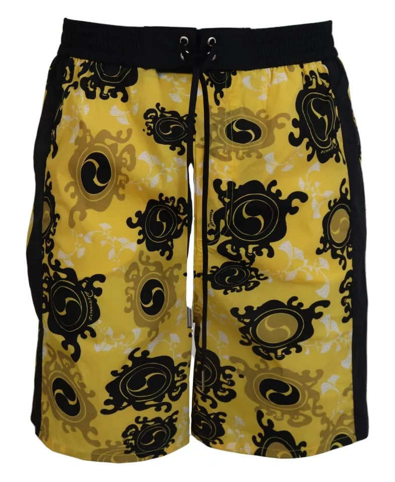 Yellow swim trunks with black trim and patterned design