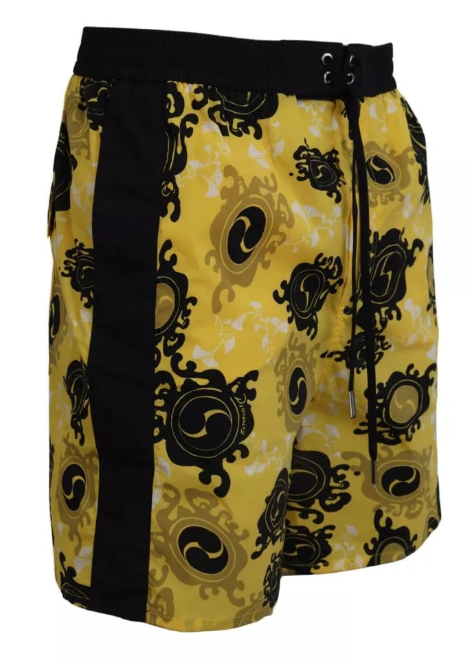 Yellow swim trunks with black trim and patterned design