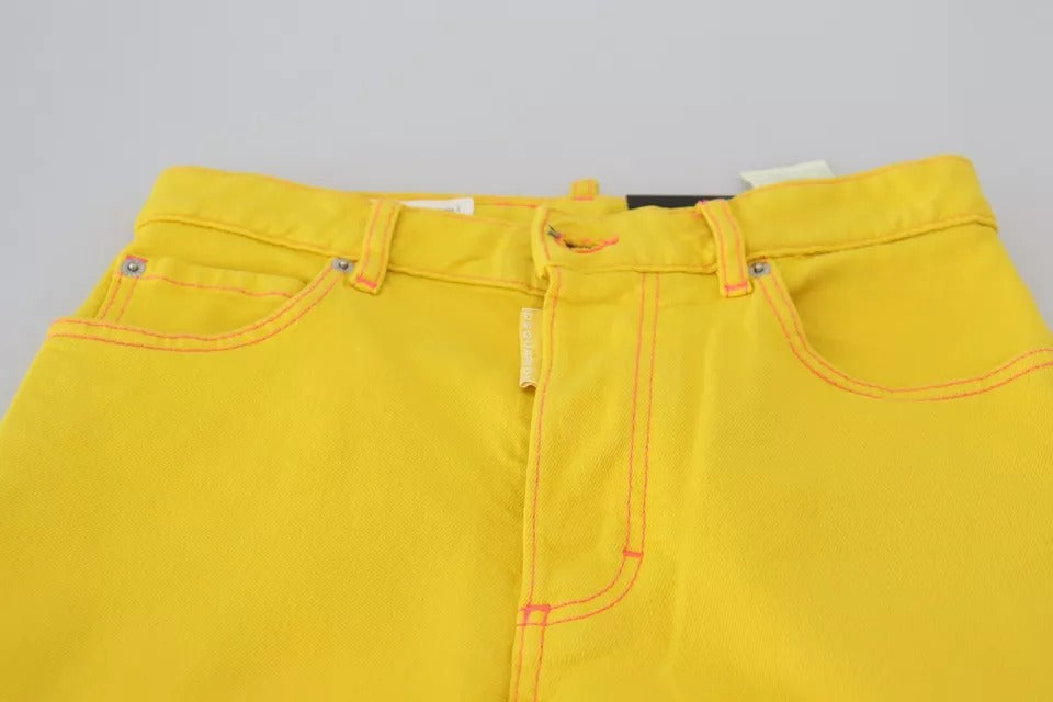 Yellow jeans on a hanger