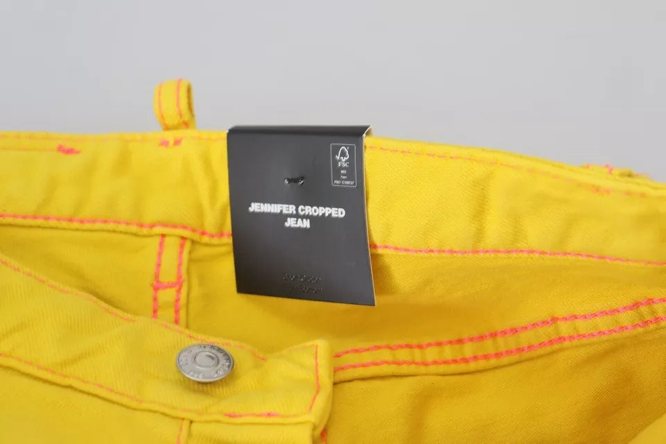 Yellow jeans on hanger with black tag