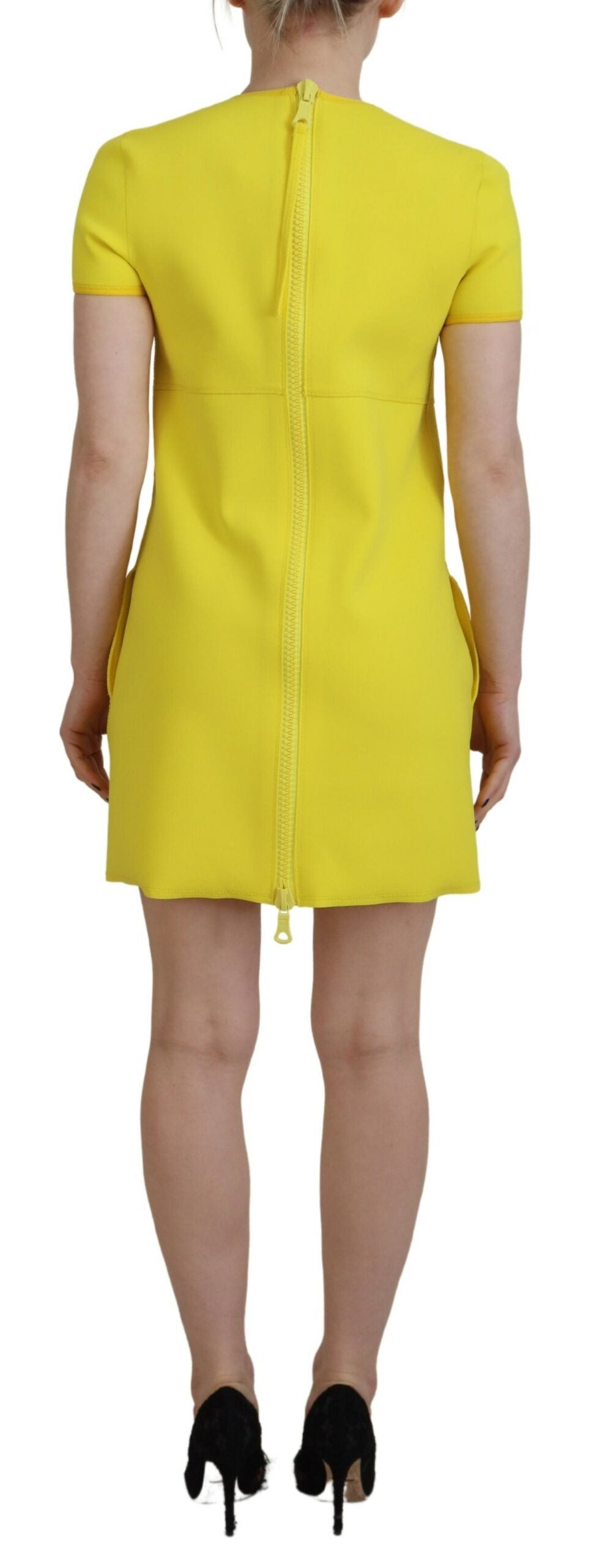 A yellow nylon dress with short sleeves and a round neckline