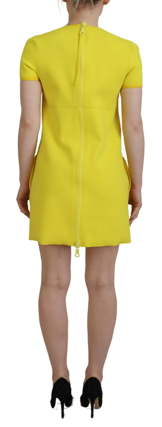 A yellow nylon dress with short sleeves and a round neckline