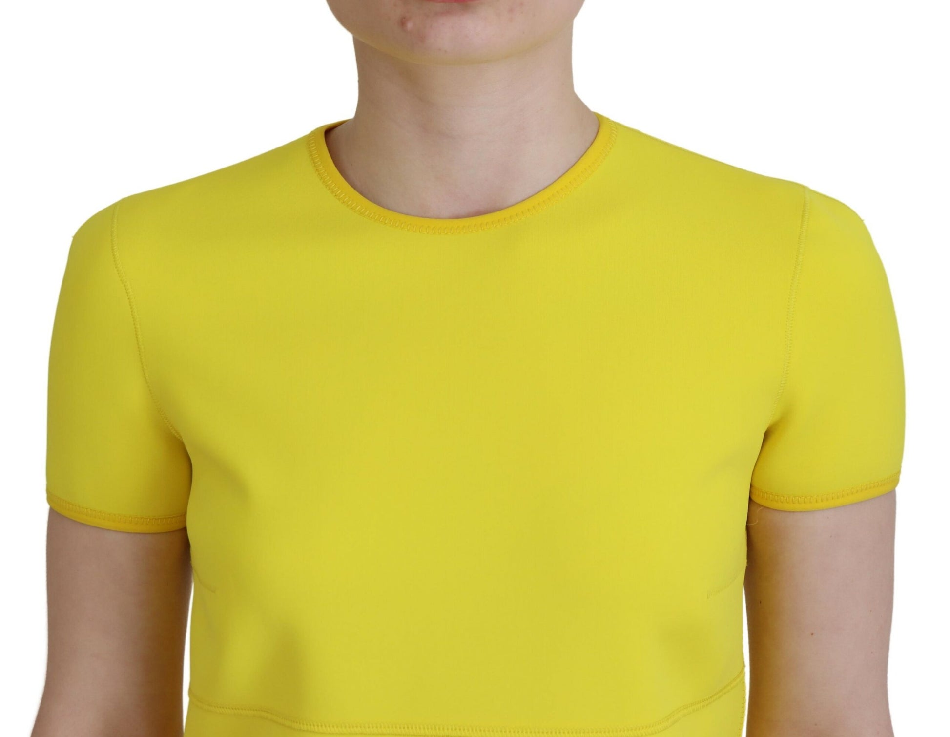 A yellow nylon dress with short sleeves and a round neckline