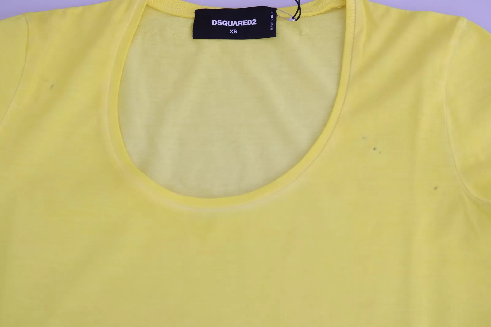 Yellow short sleeve shirt on hanger