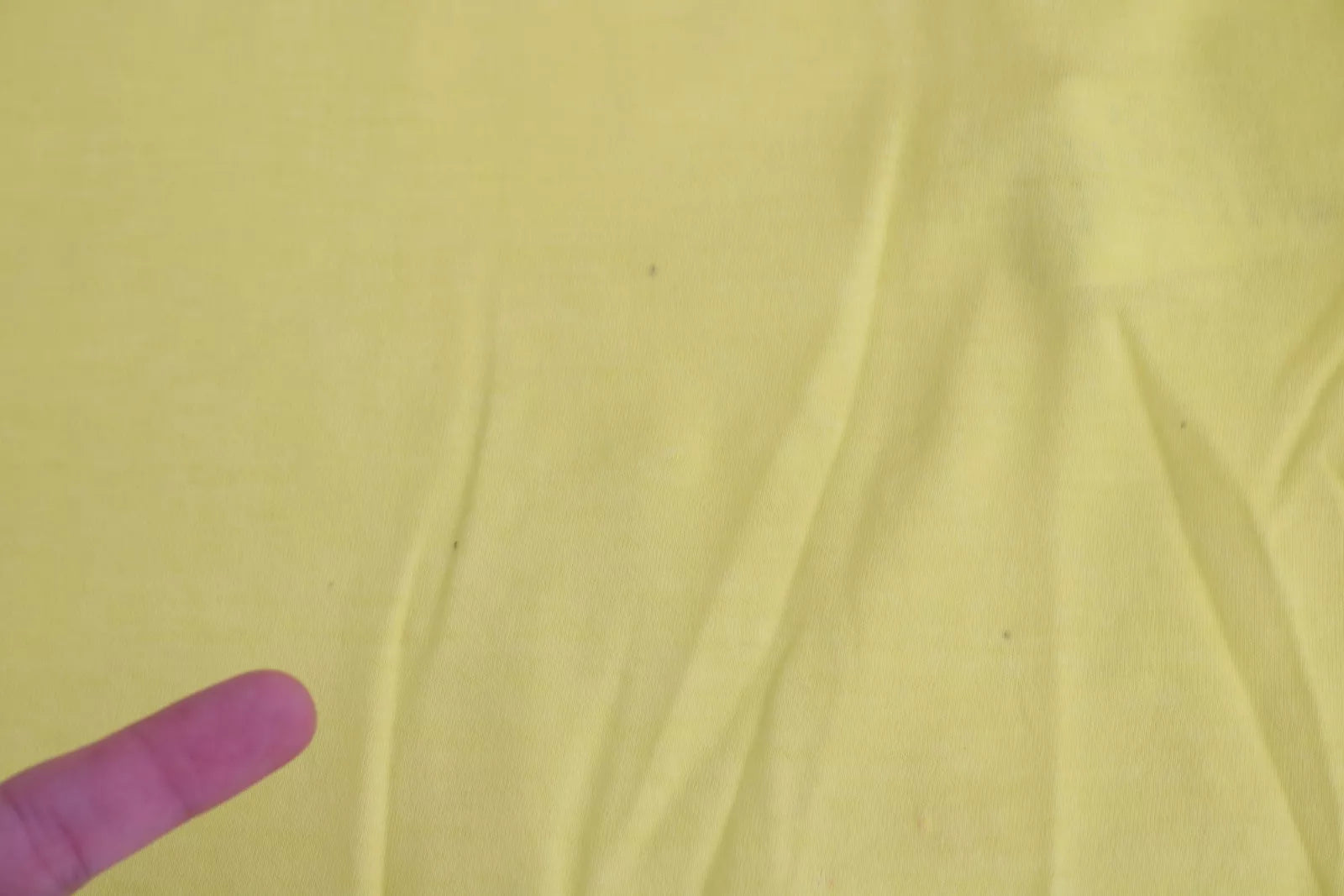 Yellow fabric with wrinkles