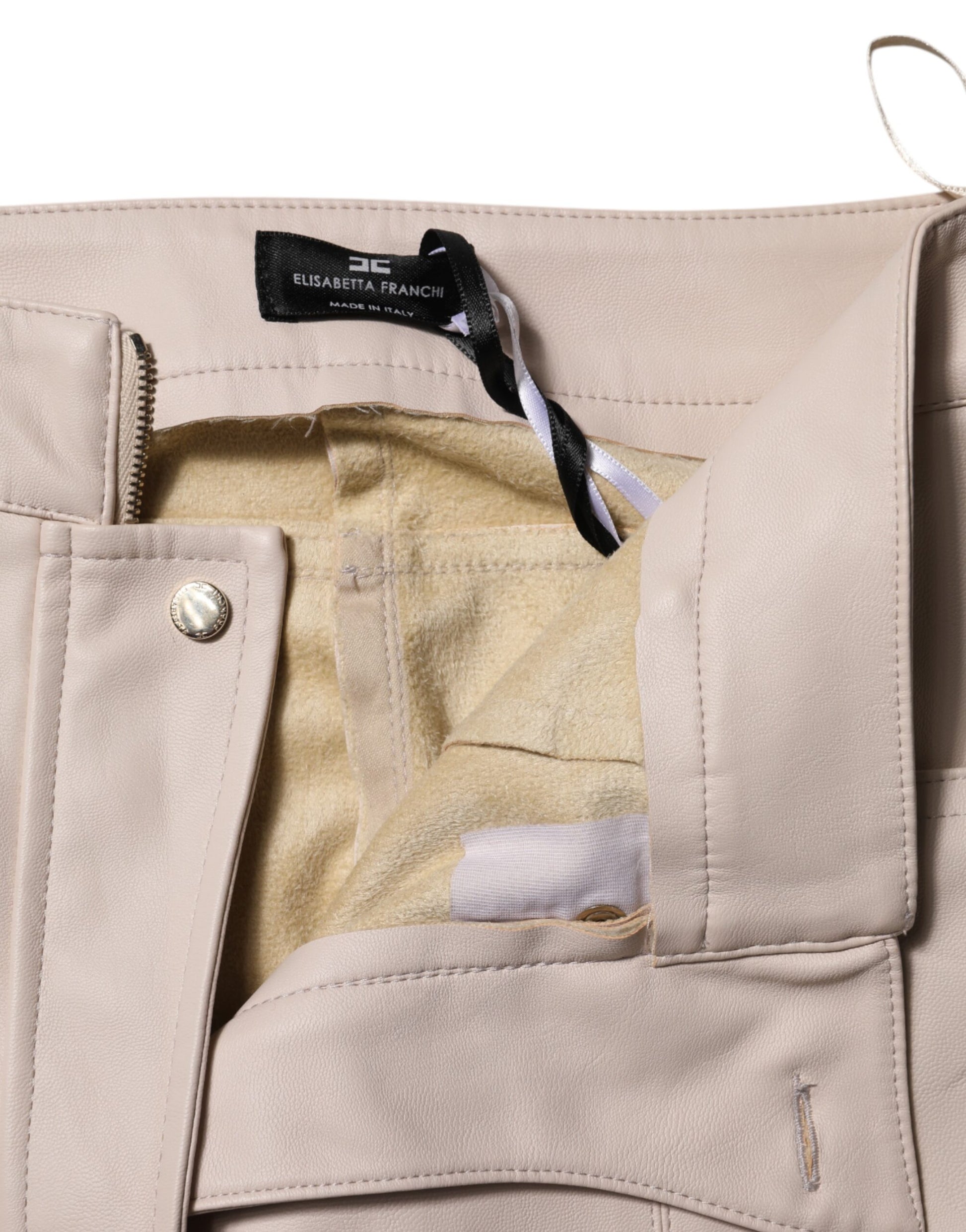 Tan jacket with zippered pocket on front