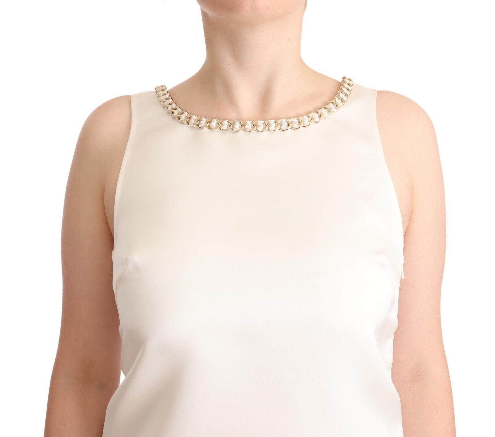A sleeveless white dress with a beaded neckline