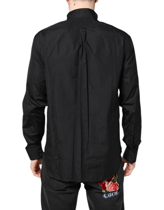 A black cotton long sleeve formal dress shirt with a button-up front
