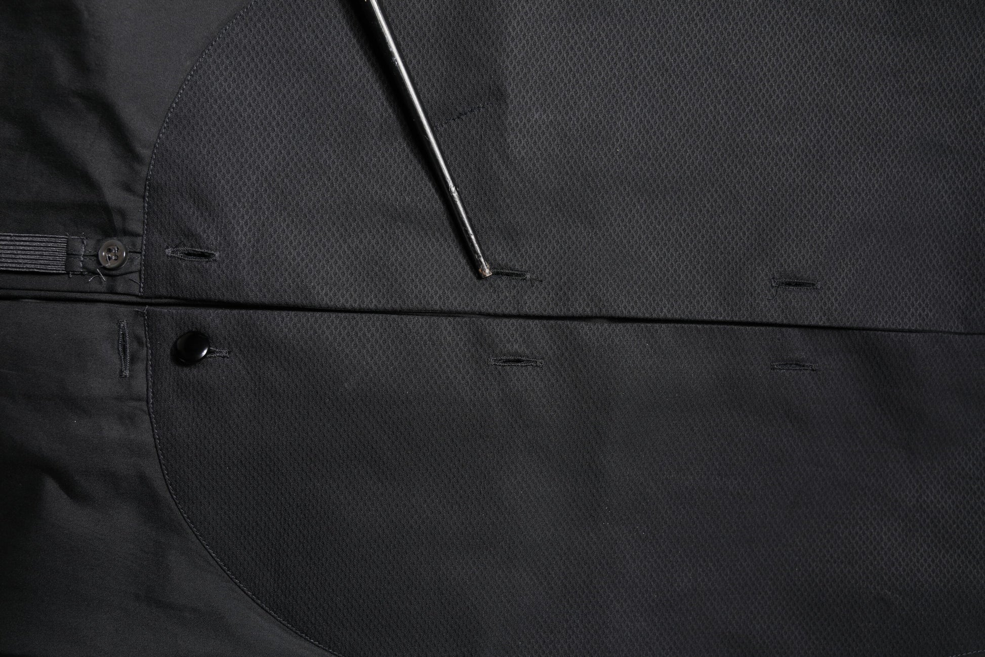 A black cotton long sleeve dress shirt with a buttoned front and collar